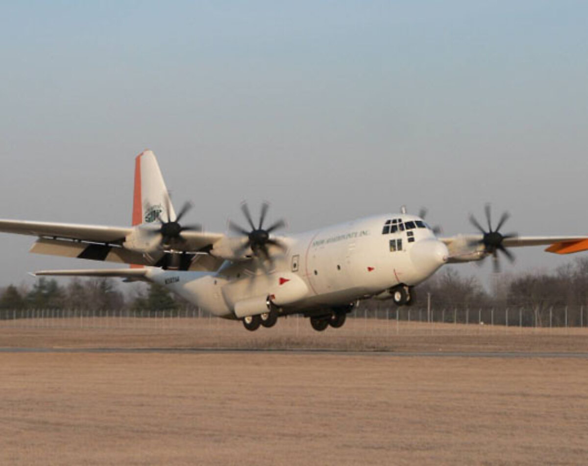 SAI-modernized C-130 with eight-blade propellers on the ramp
