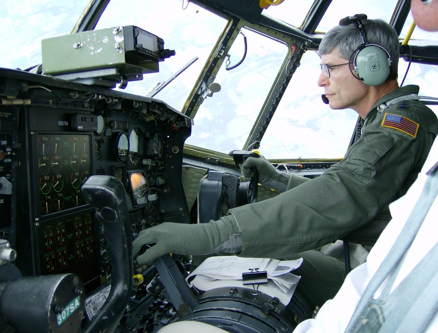 Gen. Norton Schwartz at the controls of SAI's C-130E test aircraft